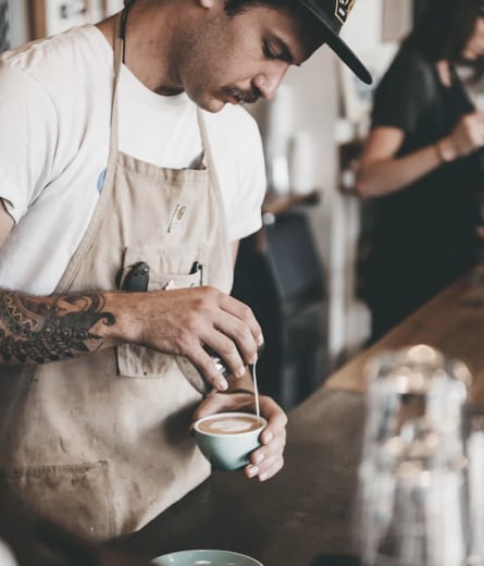 Barista pouring coffee