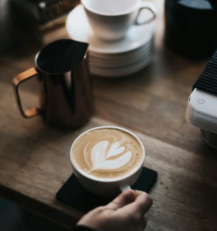 Barista pouring coffee